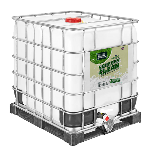 A large, white industrial container labeled "Squeaky Clean" is secured with a metal frame and placed on a black pallet.